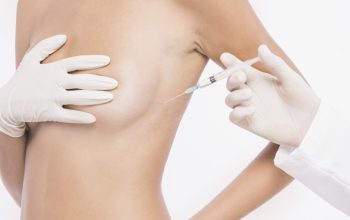 plastic-surgeon-injecting-woman-breast